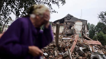 Raisa Shapoval, 83, cries in front of the site of a military strike in Chuhuiv, about 6 km from the frontline, amid Russia's invasion of Ukraine, in Kharkiv region, Ukraine July 16, 2022. (Reuters)