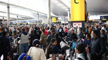 Passengers queue inside the departures terminal of Terminal 2 at Heathrow Airport in London, Britain, June 27, 2022. (Reuters)