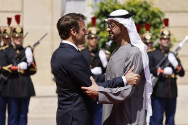 France's President Emmanuel Macron welcomes United Arab Emirates President Sheikh Mohamed bin Zayed Al-Nahyan for a working lunch at the Elysee Palace, in Paris, on July 18, 2022. (AFP)