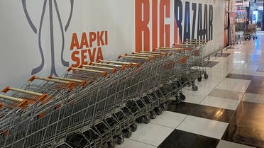 Shopping trolleys are parked outside a closed Big Bazaar retail store on the outskirts of Ahmedabad, India, February 27, 2022. (Reuters)
