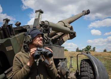 A Ukrainian service member checks an area after a shooting from a towed howitzer FH-70 at a front line, as Russia's attack on Ukraine continues, in Donbas Region, Ukraine July 18, 2022. (Reuters)