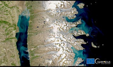 This image, acquired by one of the Copernicus Sentinel-2 satellites, shows the very significant discharge of sediment into the Arctic Ocean by glaciers melting around Constable Pynt as a result of unusually high temperatures, Greenland July 28, 2021. (Reuters)
