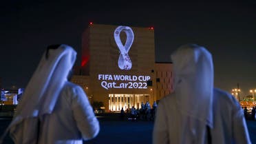 Qataris gather at the capital Doha's traditional Souq Waqif market as the official logo of the FIFA World Cup Qatar 2022 is projected on the front of a building on September 3, 2019. (AFP)