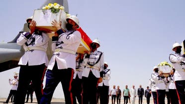 Honor guards carrying the caskets of victims killed a day earlier in a Kurdish hill village in an attack blamed on Turkey, in the presence of Prime Minister Mustafa al-Kadhimi and Iraqi officials, upon their arrival at the airport of the capital Baghdad from the Kurdish regional capital Arbil, on July 21, 2022. (Iraq’s Prime Minister’s Media Office/AFP)