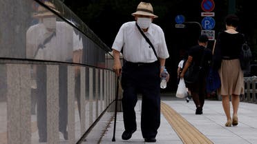 A man wearing a protective mask makes his way as the nation's capital, Tokyo, reported 31,878 cases of daily infections, surpassing the 30,000 mark for the first time amid the coronavirus disease (COVID-19) pandemic in Tokyo, Japan, on July 21, 2022. (Reuters)