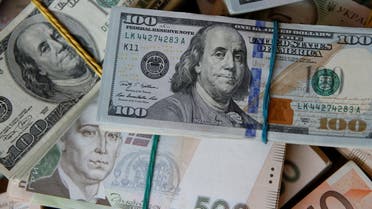 US dollar, euro and Ukrainian hryvnia banknotes are seen in this picture illustration taken in Kyiv, Ukraine, on October 31, 2016. (Reuters)