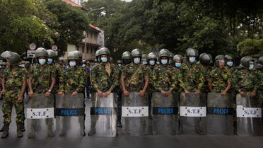 Security personnel stand guard during a protest against the raid on an anti-government protest camp early on Friday, amid the country's economic crisis, near Presidential Secretariat in Colombo, Sri Lanka July 22, 2022. (Reuters)