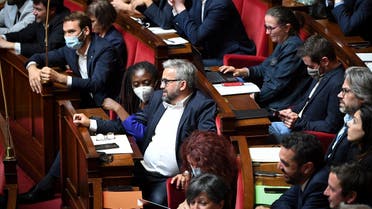 A file photo shows members of Parliament of French leftist La France Insoumise (LFI) party and member of left-wing coalition NUPES talk as French Prime Minister addresses MPs during her “general political declaration” to kick off the legislative session at The National Assembly in Paris on July 6, 2022. (AFP)