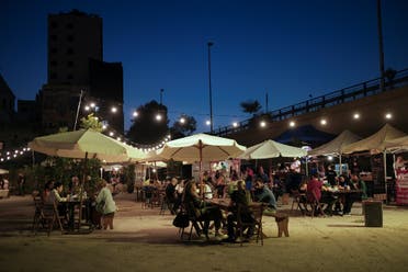 People sit at a food court of a flea market in Beirut, Lebanon June 3, 2022. Picture taken June 3, 2022. (Reuters)