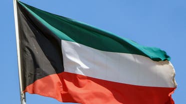 This picture taken on September 20, 2020 shows a Kuwaiti national flag flying from a mast in Kuwait City. (AFP)