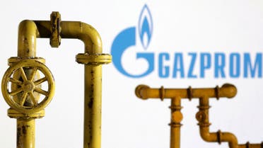 Model of natural gas pipeline and Gazprom logo, July 18, 2022. (Reuters)