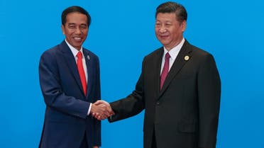 Indonesia's President Joko Widodo (L) shakes hands with Chinese President Xi Jinping during the welcome ceremony for the Belt and Road Forum, at the International Conference Center in Yanqi Lake, Beijing, China, on May 15, 2017. (Reuters)