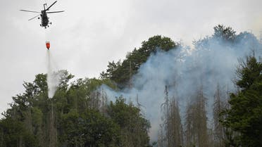 A Czech army helicopter helps to extinguish a forest fire during a heatwave close to the German-Czech border near Hrenso, Czech Republic, July 26, 2022. (File photo: Reuters)
