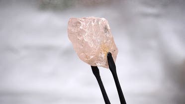 This undated handout picture released by Lucapa Diamond Company Limited on July 27, 2022 shows a 170 carat pink diamond - dubbed The Lulo Rose - that was discovered at the Lulo mine in Angola’s diamond-rich northeast region. (AFP)