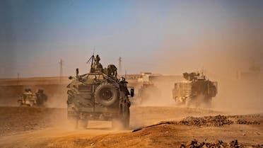Military vehicles are pictured during a joint Russian-Turkish patrol in the eastern countryside of the town of Darbasiyah near the border with Turkey in Syria's northeastern Hasakah province on July 28, 2022. (AFP)