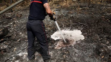 A firefighter attempts to extinguish a ground fire in Landiras, in the Gironde region, France, July 22, 2022. (Reuters)