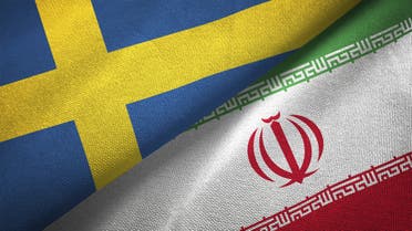 Iran and Sweden two flags together textile cloth fabric texture stock photo