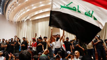 Supporters of Iraqi Shia cleric Muqtada al-Sadr protest against corruption, inside the parliament in Baghdad, Iraq July 30, 2022. (Reuters)