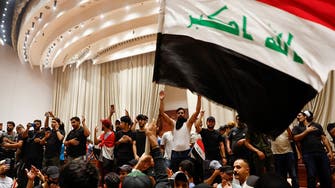 Protesters storm parliament in Iraq, organize sit-in as council sessions suspend