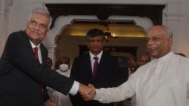 Dinesh Gunawardena is sworn in as the new Prime Minister before President Ranil Wickremesinghe, amid the country's economic crisis, in Colombo, Sri Lanka, on July 22, 2022. (Reuters)