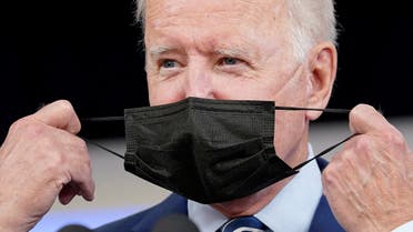 President Joe Biden removes his face mask prior to receiving his coronavirus disease (COVID-19) booster vaccination in the Eisenhower Executive Office Building's South Court Auditorium at the White House in Washington, U.S., September 27, 2021. (Reuters)