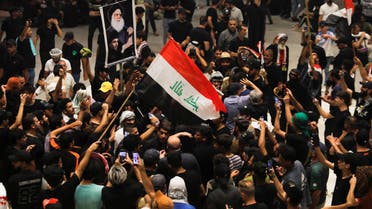 Supporters of Iraqi Shia cleric leader Muqtada al-Sadr gather during a sit-in at the parliament building, amid political crises in Baghdad, Iraq July 31, 2022. (Reuters)