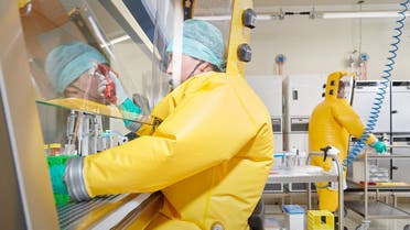 Employees of Spiez Lab work in the BSL-4 facility that is available to the World Health Organisation (WHO) as a repository for SARS-CoV-2 viruses or other pathogens with epidemic or pandemic potential, in Spiez, Switzerland. (Reuters)