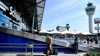 Amsterdam’s Schiphol Airport says passenger caps to continue through October