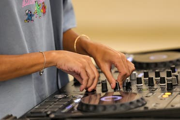 Saudi DJ Leen Naif plays at a university event in Saudia Arabia's Red Sea coastal city of Jeddah on May 26, 2022. Women DJs, an unthinkable phenomenon just a few years ago in the traditionally conservative Saudi kingdom, are becoming a relatively common sight in its main cities. (AFP)