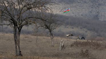 An Azeri soldier is seen at fighting positions near the village of Taghavard in the region of Nagorno-Karabakh, January 18, 2021. Following the military conflict over Nagorno-Karabakh and a further signing of a ceasefire deal, the village was divided into two parts: the Azeri forces stayed in the upper western end and those ethnic Armenians who did not flee live now in the east, reinforced by armed units. Picture taken January 18, 2021. REUTERS/Artem Mikryukov