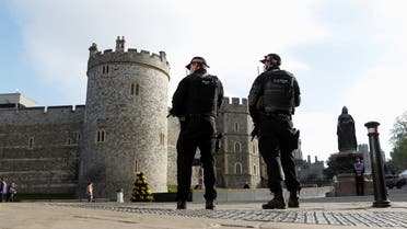 Police officers stand near Windsor Castle after Britain's Prince Philip, husband of Queen Elizabeth II, died at the age of 99, in Windsor, Britain, April 16, 2021. REUTERS/Peter Nicholls