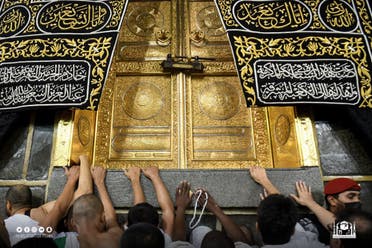 Worshippers touch the Kaaba after the barriers were removed. (Twitter)