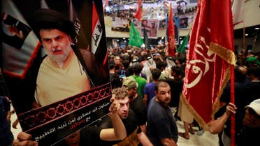Supporters of Iraqi cleric Moqtada Sadr, protesting against a rival bloc's nomination for prime minister, continue their sit-in inside Iraq's parliament in the capital Baghdad's high-security Green Zone, on August 2, 2022. (AFP)