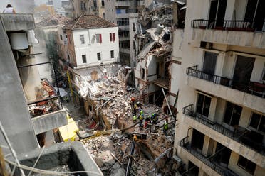 Rescue workers dig through the rubble of a badly damaged building in Lebanon's capital Beirut, in search of possible survivors from a mega-blast at the adjacent port one month ago, after scanners detected a pulse, on September 4, 2020. (AFP)