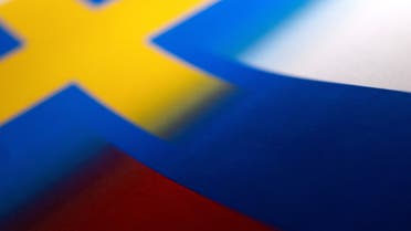 Swedish and Russian flags are seen printed on paper this illustration taken April 13, 2022. (Reuters)