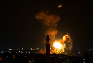 Smoke and fire rise above Khan Yunis in the southern Gaza strip, during an Israeli air strike, on August 5, 2022. (AFP)