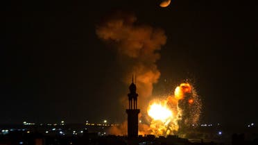 Smoke and fire rise above Khan Yunis in the southern Gaza strip, during an Israeli air strike, on August 5, 2022. (AFP)