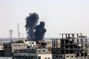 Smoke billows from a building struck during an Israeli air strike in Rafah in the southern Gaza Strip, on August 7, 2022. (AFP)