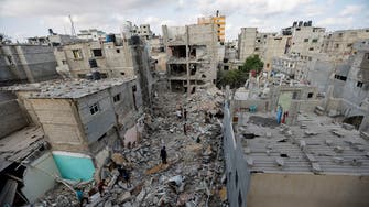 Palestinians sift through rubble at Gaza camp hit in Israeli strike