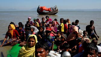Hundreds of Rohingya refugees arrive in western Indonesia by boat