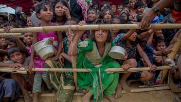 Rohingya Muslim children who crossed over from Myanmar into Bangladesh, wait squashed against each other to receive food handouts distributed to children and women by a Turkish aid agency at Thaingkhali refugee camp, Bangladesh, Saturday, Oct. 21, 2017. A new report has found that Facebook failed to detect blatant hate speech and calls to violence against Myanmar’s Rohingya Muslim minority years after such behavior was found to have played a determining role in the genocide against them. (AP Photo/Dar Yasin, File)