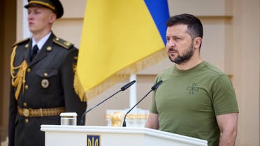 This handout picture taken and released by Ukrainian Presidential Press-service shows the President Volodymyr Zelensky taking part in the ceremony of presenting orders and the other state awards to the servicemen and to the members of the families of fallen soldiers in Kyiv on August 7, 2022, on the occasion of the of the Air Force of Ukraine Day. (AFP)