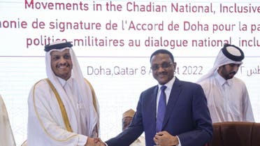 Qatar's Deputy Prime Minister and Foreign Minister Sheikh Mohammed bin Abdulrahman Al-Thani shakes hands with Chad's Foreign Minister Mahamat Zene Cherif during a signing agreement for a national dialogue with Chad's transitional military authorities and rebels at Sheraton Hotel in Doha, Qatar August 8, 2022. (Reuters) 