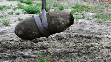  A World War Two bomb is seen being removed a few days after being discovered in the dried-up river Po which suffered from the worst drought in 70 years, in Borgo Virgilio, Italy on August 7, 2022. (Reuters)
