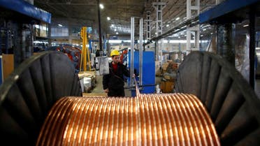 A worker checks copper cables being produced at a factory in the central Anatolian city of Kayseri. (Reuters)