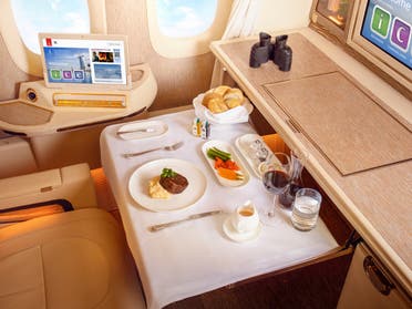 Emirates airline cabin with food served. (Supplied)