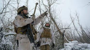 Service members of the Ukrainian armed forces are seen at combat positions near the line of separation from Russian-backed rebels outside a village of Pisky in Donetsk Region, Ukraine January 29, 2022. (Reuters)