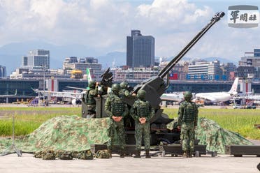 Taiwan Air Force soldiers operate a 35-mm anti-aircraft gun during a military drill at Taipei Songshan Airport in Taiwan, August 8, 2022 in this handout picture released on August 10, 2022. (Reuters)