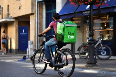 A bicycle courier from Uber Eats rides his bicycle during the heatwave in Utrecht, Netherlands August 10, 2022. (Reuters)