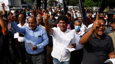 Protesters shout slogans during a march to mark one month since a massive protest forced then Sri Lankan President Gotabaya Rajapaksa to flee the country and step down, amid the country's economic crisis, in Colombo, Sri Lanka, August 9, 2022. REUTERS/Kim Kyung-Hoon